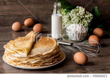 Delicious pancakes on wooden table 30680821