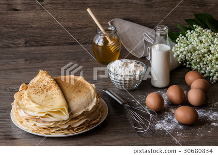 Delicious pancakes on wooden table 30680834