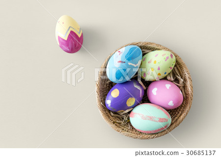 A variety easter painted eggs is in bucket. 30685137