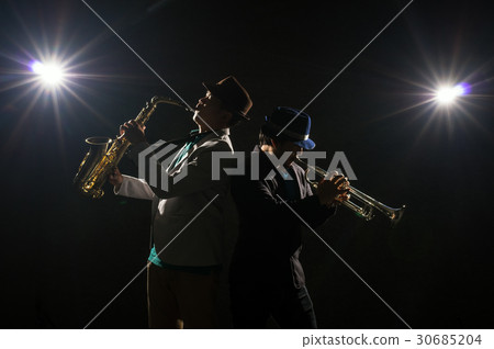Musician Duo band playing the Trumpet with spot light and lens flare on the stage, musical concept Musician Duo band playing the Trumpet with spot light and lens flare on the stage, musical concept 30685204