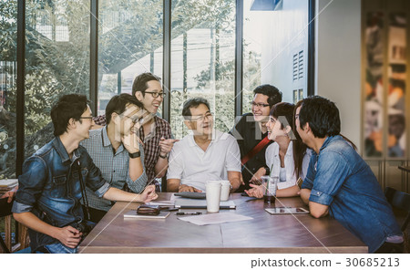 Group Of Asian Business people with casual suit working with happy action in in the Office or coffee shop, people business group concept Group Of Asian Business people with casual suit working with happy action in in the Office or coffee shop, people business group concept 30685213
