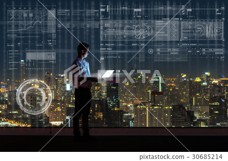 Asian businessman standing and using the laptop showing digital virtual screen over the cityscape background at night time, Business technology and innovation concept Asian businessman standing and using the laptop showing digital virtual screen over the cityscape background at night time, Business technology and innovation concept 30685214
