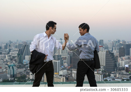 Couple businessman shake hand for deal the business over the cityscape background at evening time, Business success concept 30685333