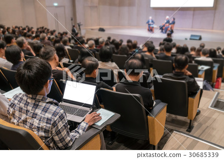 Rear view of Audience over the speakers on the stage in the conference hall or seminar meeting, business and education concept Rear view of Audience over the speakers on the stage in the conference hall or seminar meeting, business and education concept 30685339