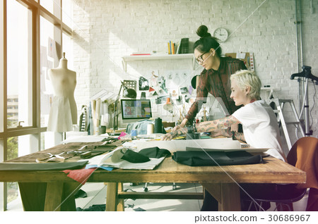 Fashion designer brainstorming and sharing ideas Fashion designer brainstorming and sharing ideas 30686967