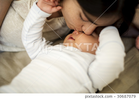 Mother is taking care of her baby. Mother is taking care of her baby. 30687079