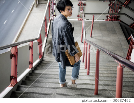 Asian Guy Walking Down Stairs Asian Guy Walking Down Stairs 30687492