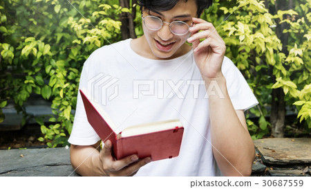 Asian Guy Reading Book Diary 30687559