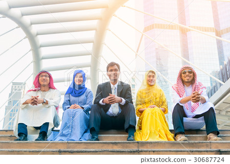 businessmen and women sitting in city 30687724