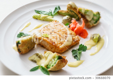 salmon steak with vegetables salmon steak with vegetables 30688070