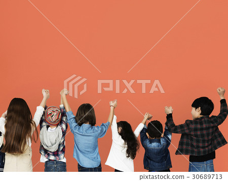 Group of children holding hand together in rear view Group of children holding hand together in rear view 30689713