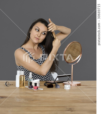 Elegance woman wearing makeup herself Elegance woman wearing makeup herself 30689715
