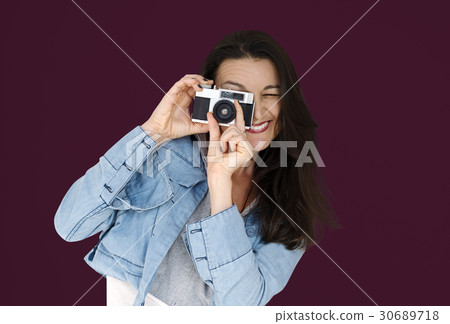 A woman using camera to capture A woman using camera to capture 30689718