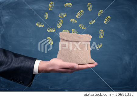 A businessman's hand turned up and a small money 30691333