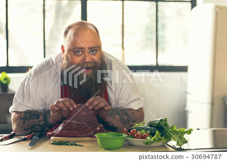 Happy thick guy cooking in kitchen Happy thick guy cooking in kitchen 30694787