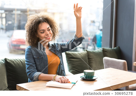 Beaming female asking worker of cafeteria Beaming female asking worker of cafeteria 30695278