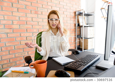 Attractive girl talking on mobile disappointedly 30697516