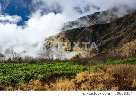 Mountain climbing · Gathering clouds 30698394