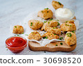 Delicious nuggets served on the board with two 30698520