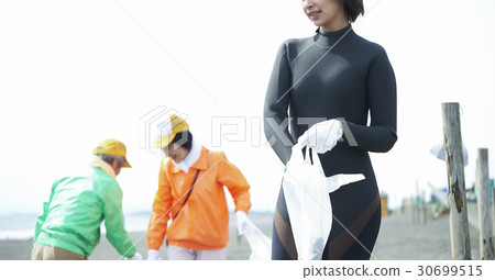 Senior volunteers and surfers to clean the beach Senior volunteers and surfers to clean the beach 30699515