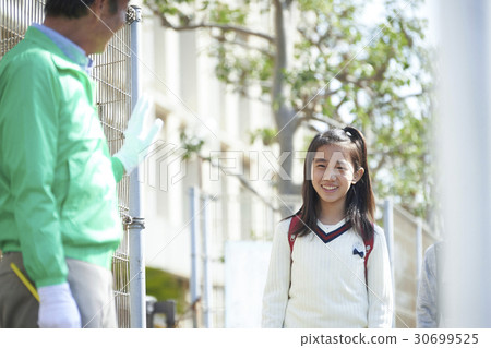 Elementary school students walking on the school road 30699525