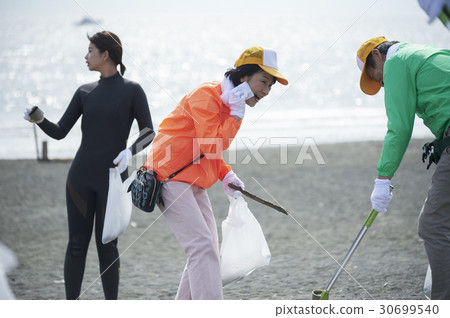 Senior volunteers and surfers to clean the beach Senior volunteers and surfers to clean the beach 30699540