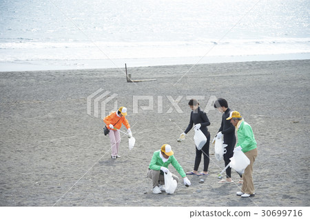 Senior volunteers and surfers to clean the beach 30699716