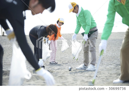 Senior volunteers and surfers to clean the beach Senior volunteers and surfers to clean the beach 30699736