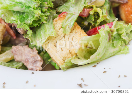 Warm beef salad with croutons. 30700861