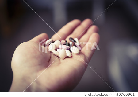 pills in woman hand, drug addiction pills in woman hand, drug addiction 30700901
