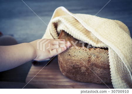 home made cereal bread in yellow cloth on wooden home made cereal bread in yellow cloth on wooden 30700910