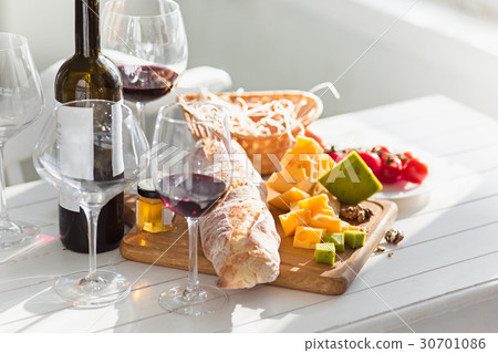 Wine, baguette and cheese on wooden background Wine, baguette and cheese on wooden background 30701086
