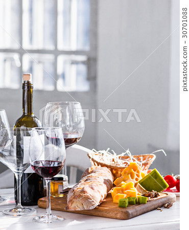 Wine, baguette and cheese on wooden background Wine, baguette and cheese on wooden background 30701088
