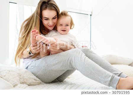 Joyful mother expressing tenderness to her child 30701595