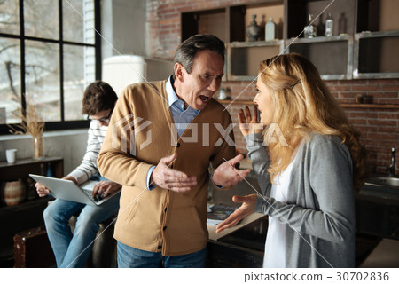 Screaming man looking at his woman 30702836