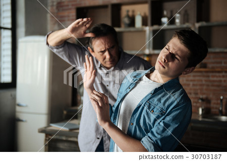 Serious boy evading from punishment Serious boy evading from punishment 30703187