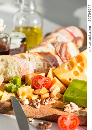 The baguette and cheese on wooden background 30704945