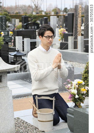 a visit to a grave  30705033