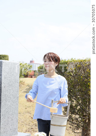 a visit to a grave  30705075