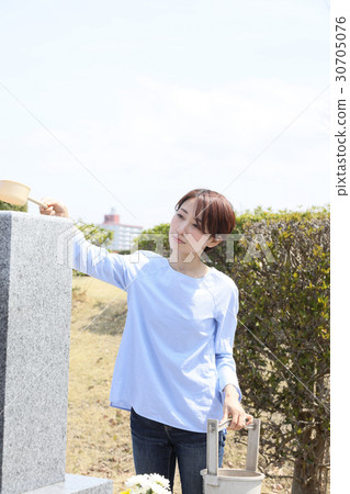 a visit to a grave  30705076