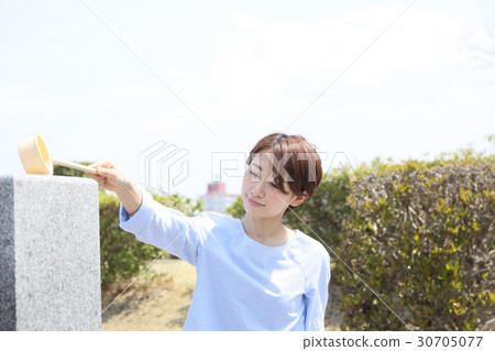 a visit to a grave  30705077