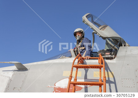Military pilot in the cockpit of a jet aircraft Military pilot in the cockpit of a jet aircraft 30705129