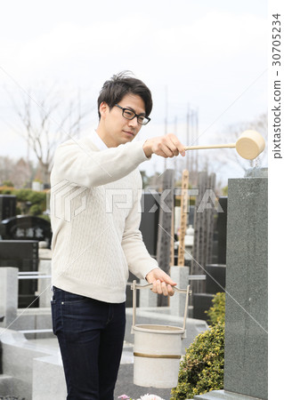 a visit to a grave  30705234