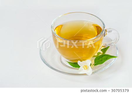 Glass cup of tea with jasmine on the white 30705379