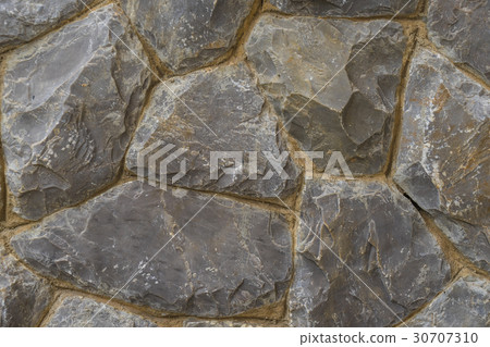 Rough stone of different shades Stacked Stone Wall Rough stone of different shades Stacked Stone Wall 30707310