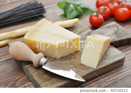 Parmesan cheese on cutting board 30710522