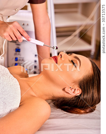 Facial massage at beauty salon. Electric Facial massage at beauty salon. Electric 30713575