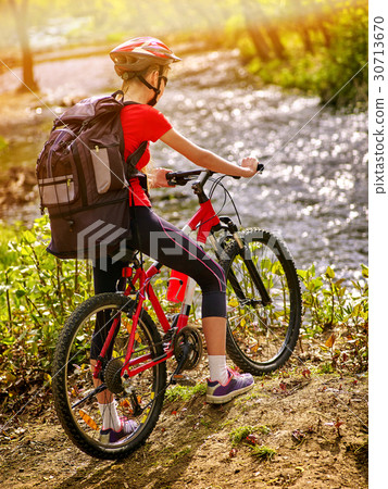 Bicycle teen with ladies bikes in summer park 30713670
