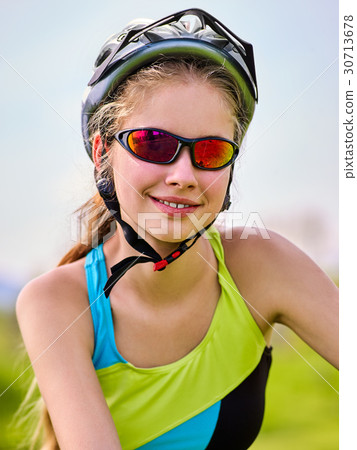 Woman traveling bicycle summer park. Early morning 30713678