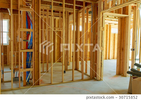 unfinished wood frame building or a house 30715852